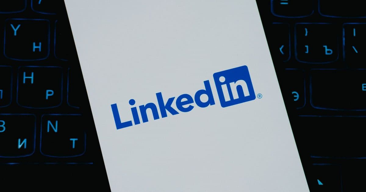 Person writing a LinkedIn connection message on a laptop